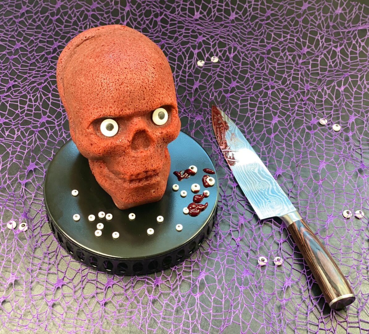 A skeleton head shaped candy with a knife