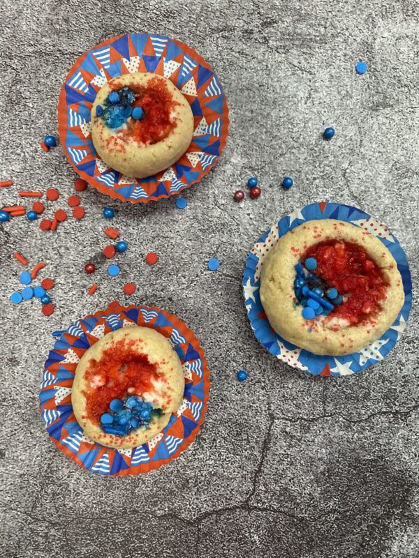 Three doughs with red and blue toppings