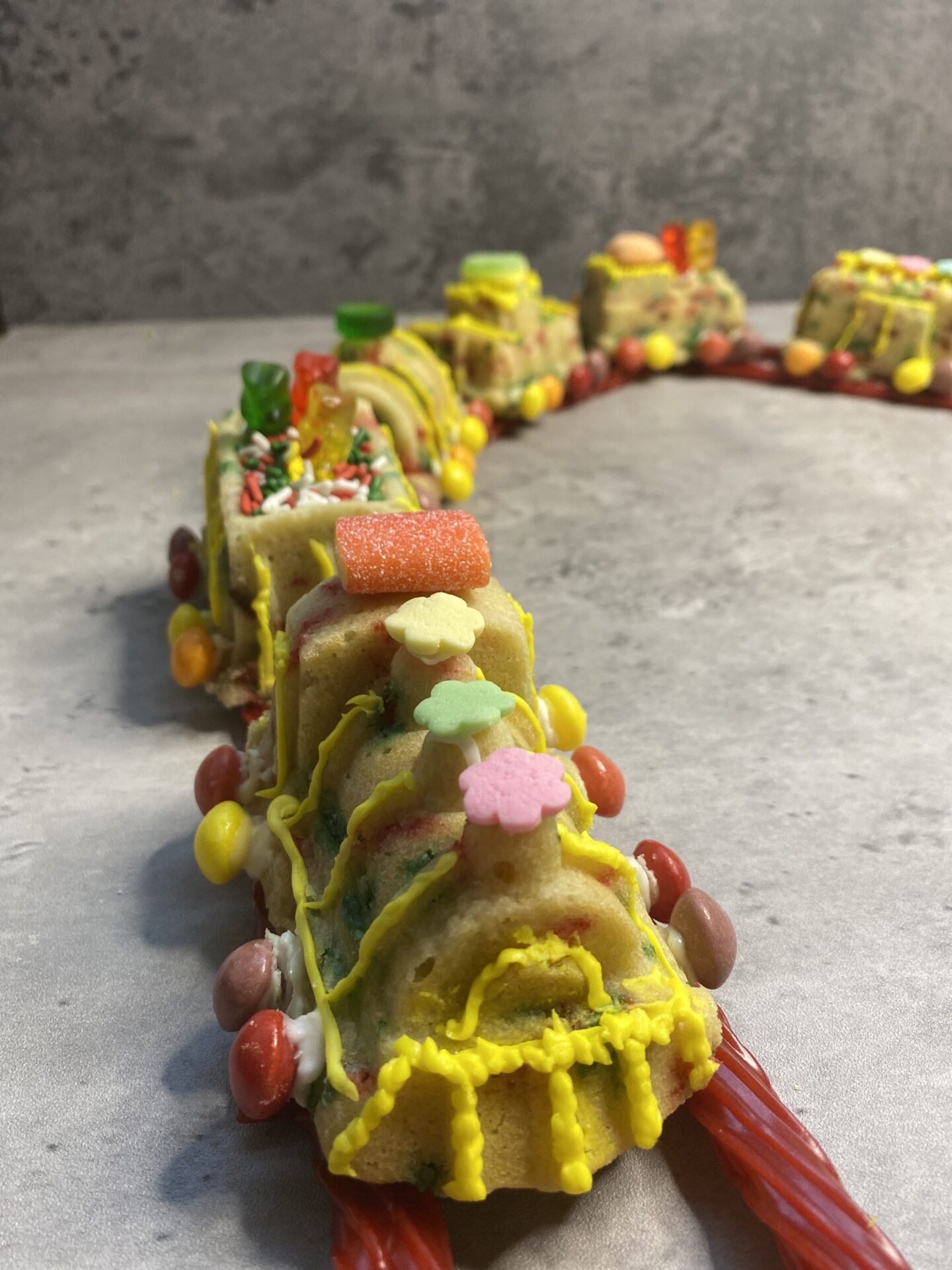 A Train Shaped Cookie With Candy Decoration Copy