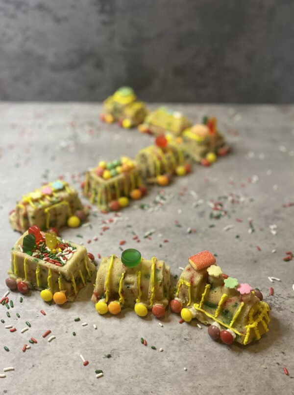 A Train Cake With Candy Decoration