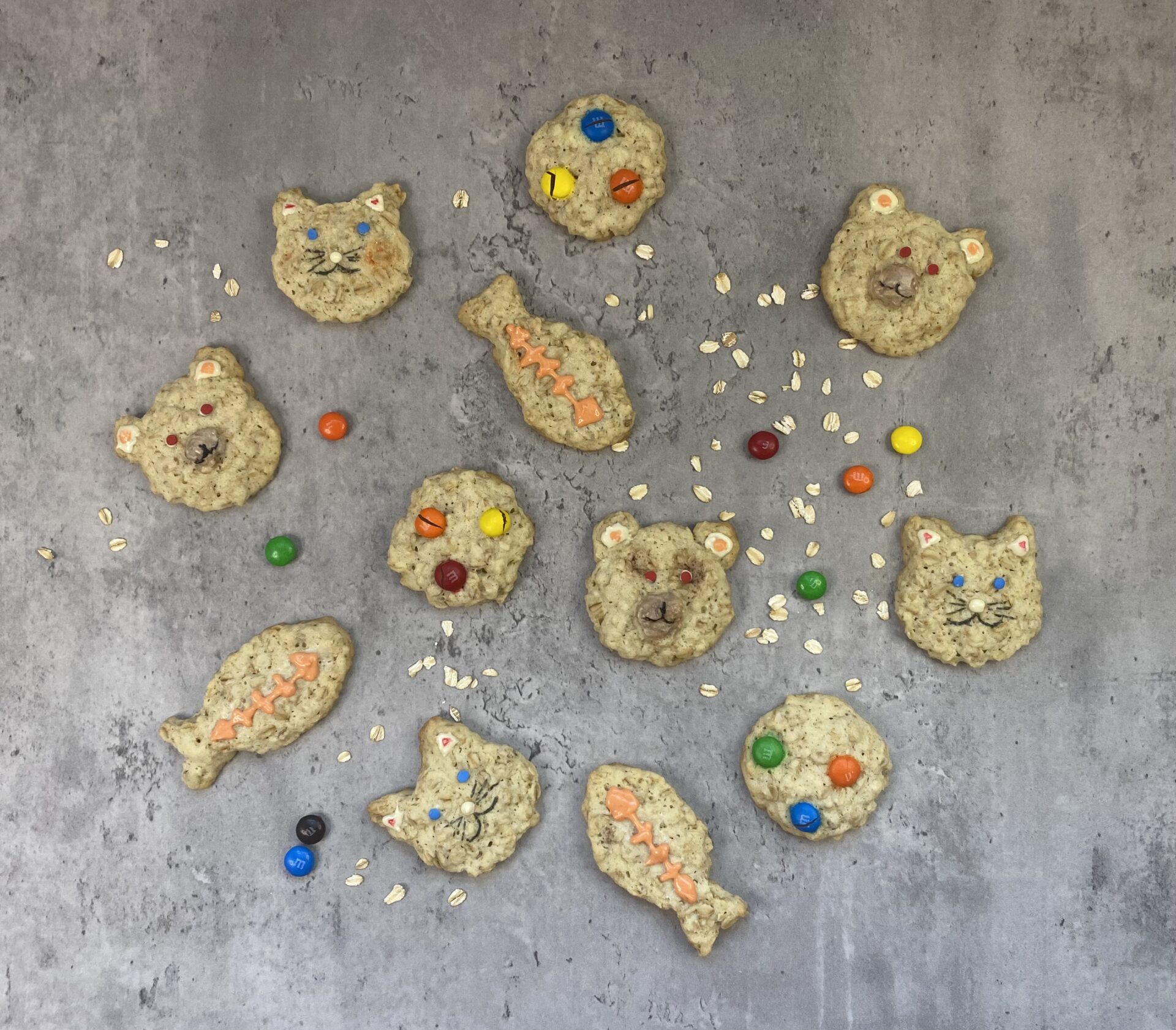 Pieces of cookies in different shapes, such as fish, bear, cat, and ball