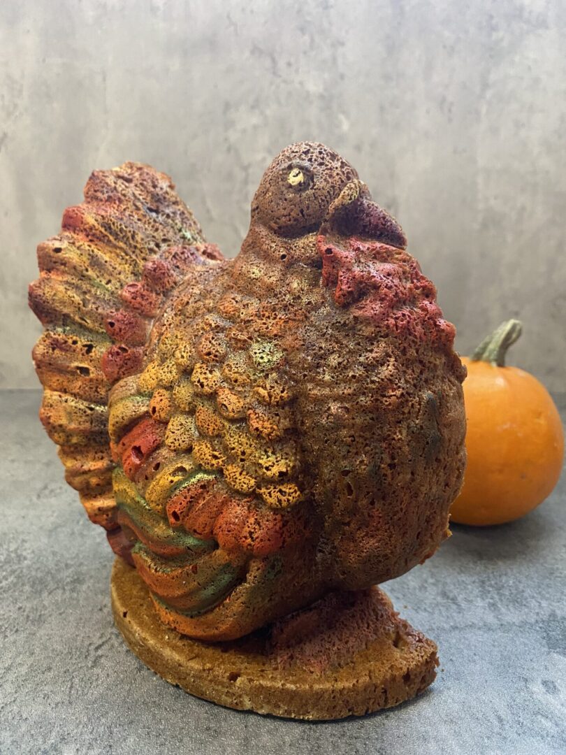 A Turkey Shaped Pumpkin Spices Cake With Cream Cheese Two