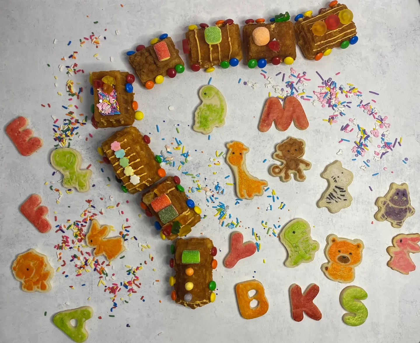 Cookies with letters and dinosaurs