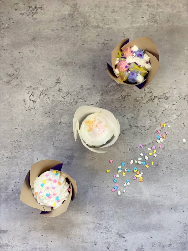 Three colorful cupcakes