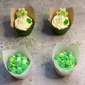 Four green-themed cupcakes